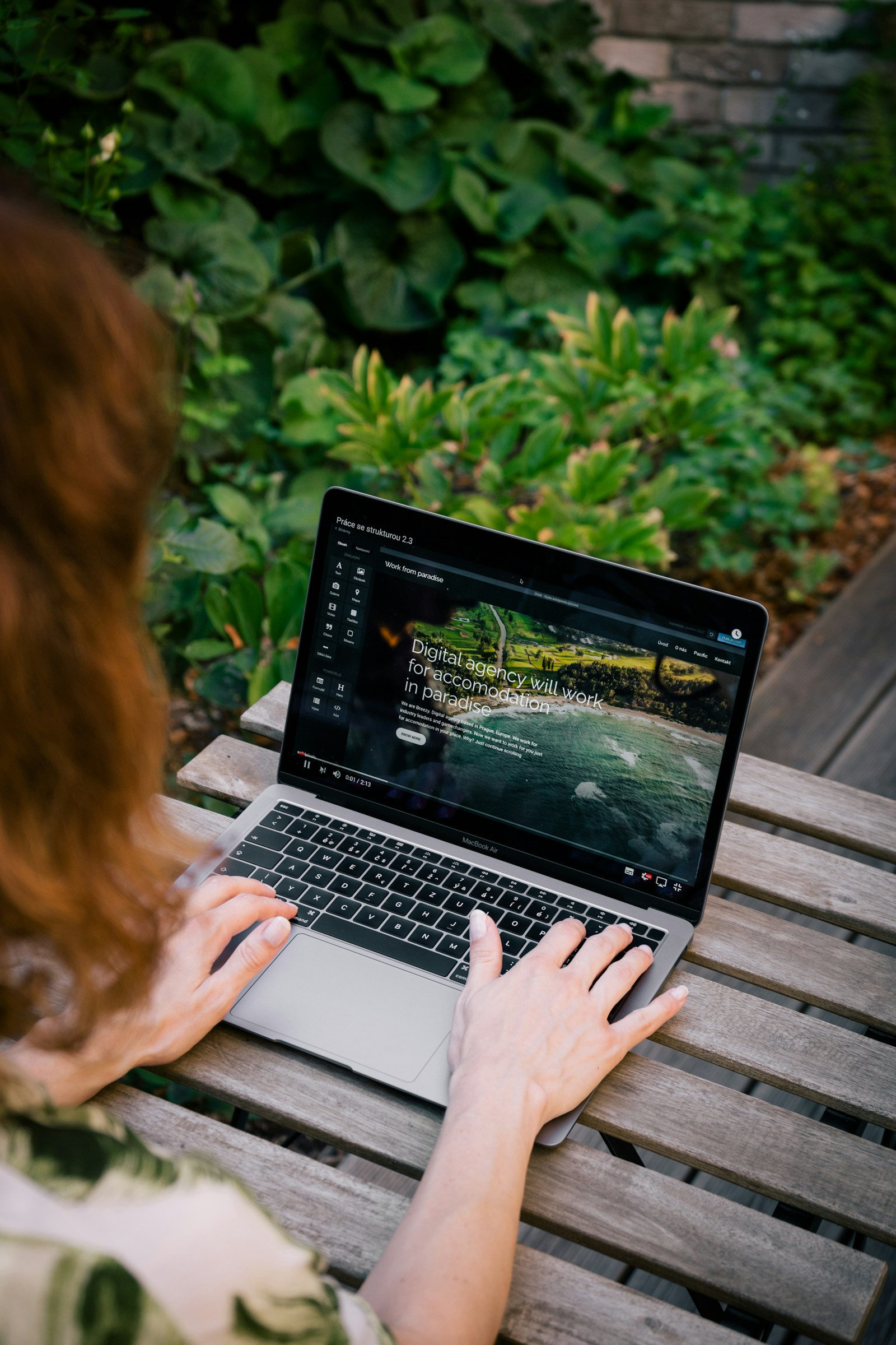 Professional reviewing a website on a laptop